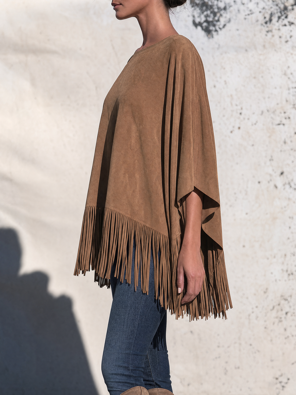 Bartolomea | Poncho in leerkleur met franjes