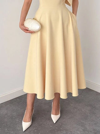 Elegante Mouwloze Midi-Jurk met Strikdetail in Slim-Fit