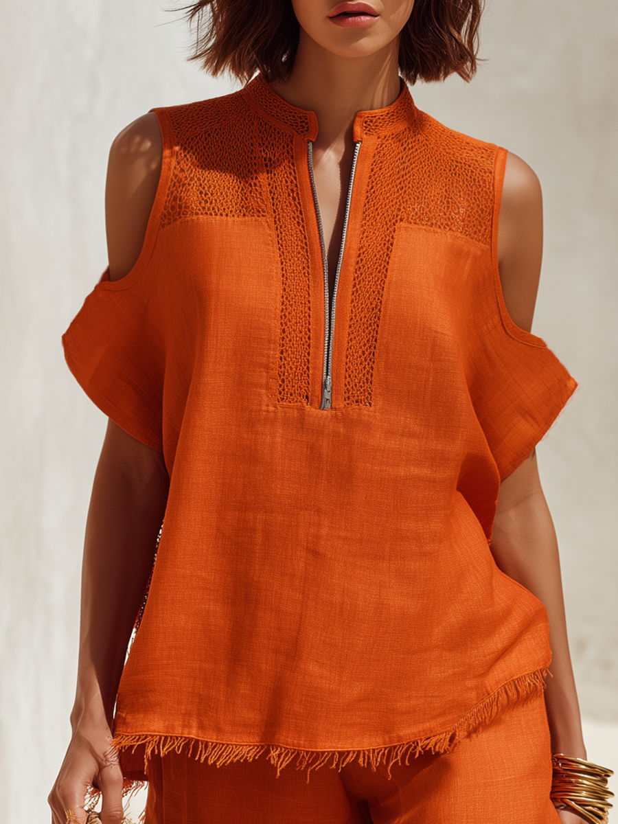 Chique bohemien setje met oranje top met korte mouwen, uitsnijdingen en gerafelde zoom, en bijpassende korte broek