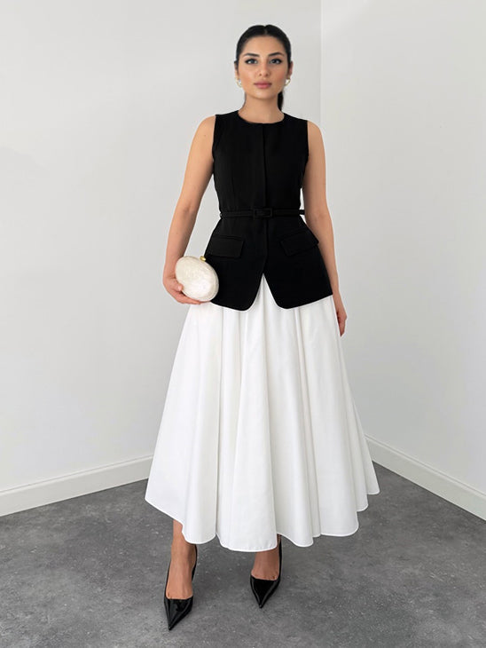 Elegante Mouwloze Vest en Witte Flared Midi Rok Twee-Delige Set