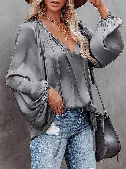V-Hals Blouse met Strik - Lantaarnmouwen en Drapé Ontwerp