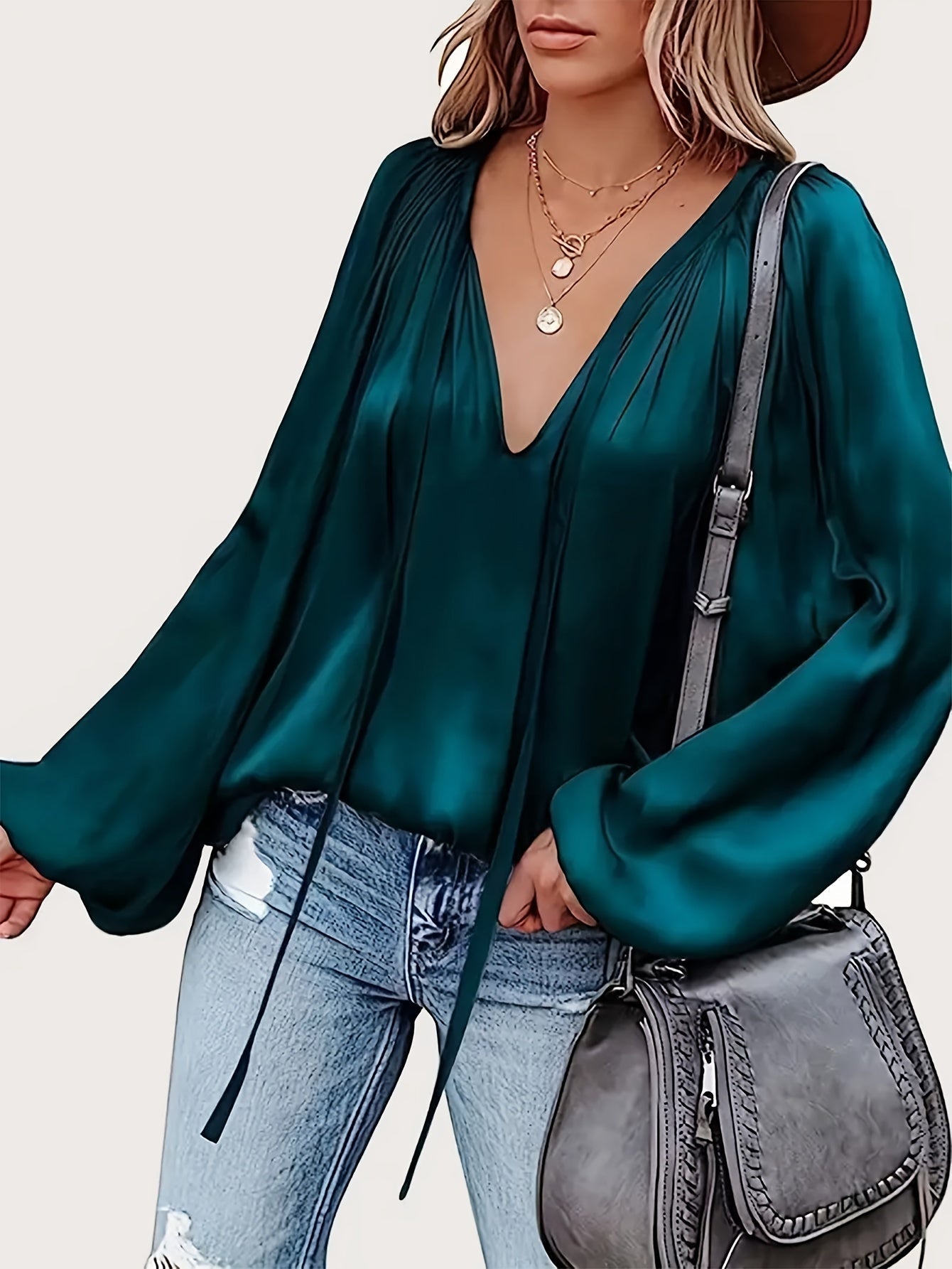 V-Hals Blouse met Strik - Lantaarnmouwen en Drapé Ontwerp