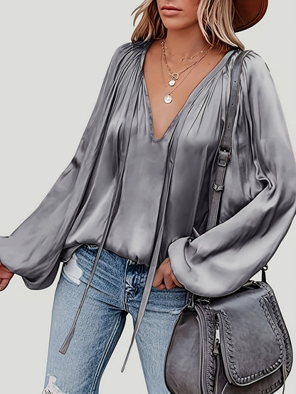 V-Hals Blouse met Strik - Lantaarnmouwen en Drapé Ontwerp