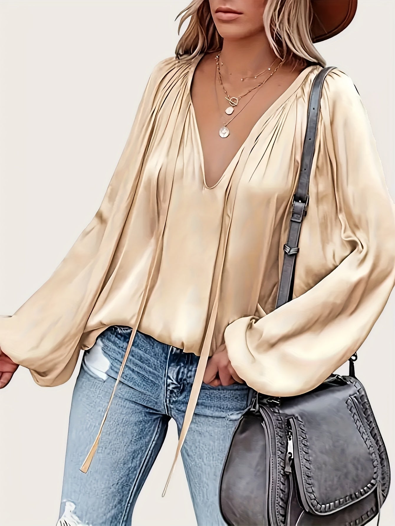 V-Hals Blouse met Strik - Lantaarnmouwen en Drapé Ontwerp