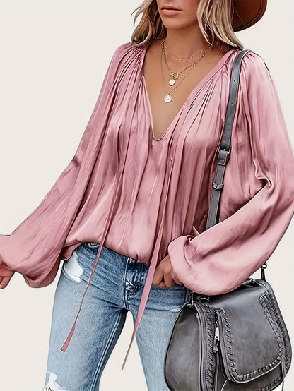 V-Hals Blouse met Strik - Lantaarnmouwen en Drapé Ontwerp