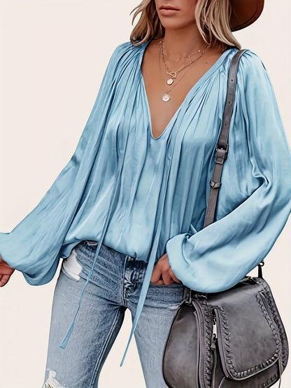 V-Hals Blouse met Strik - Lantaarnmouwen en Drapé Ontwerp
