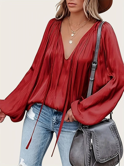 V-Hals Blouse met Strik - Lantaarnmouwen en Drapé Ontwerp