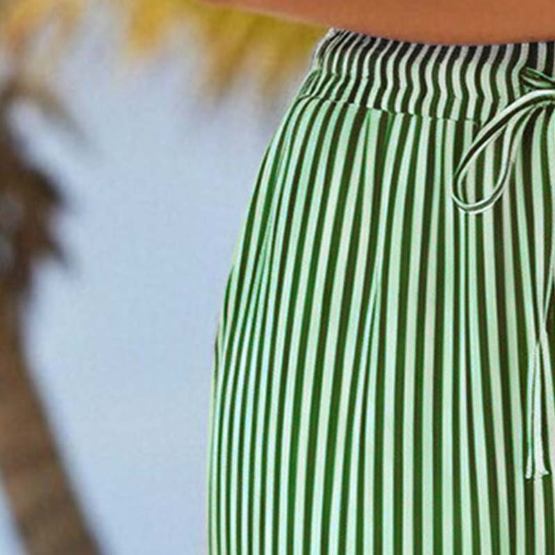 Gestreepte capribroek van een katoen-linnenmix voor dames, met zakken