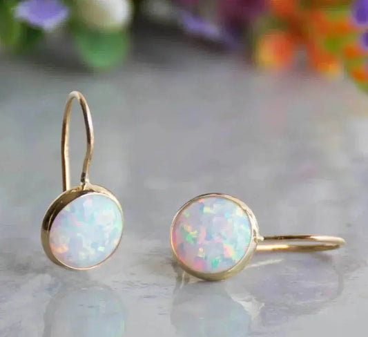 Gouden oorbellen met vintage opaalsteen